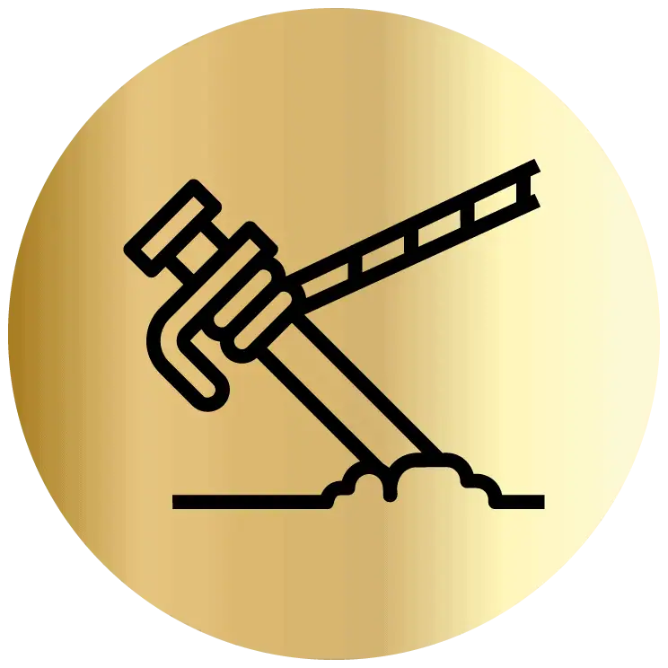 Demolition hammer breaking concrete at a construction site.